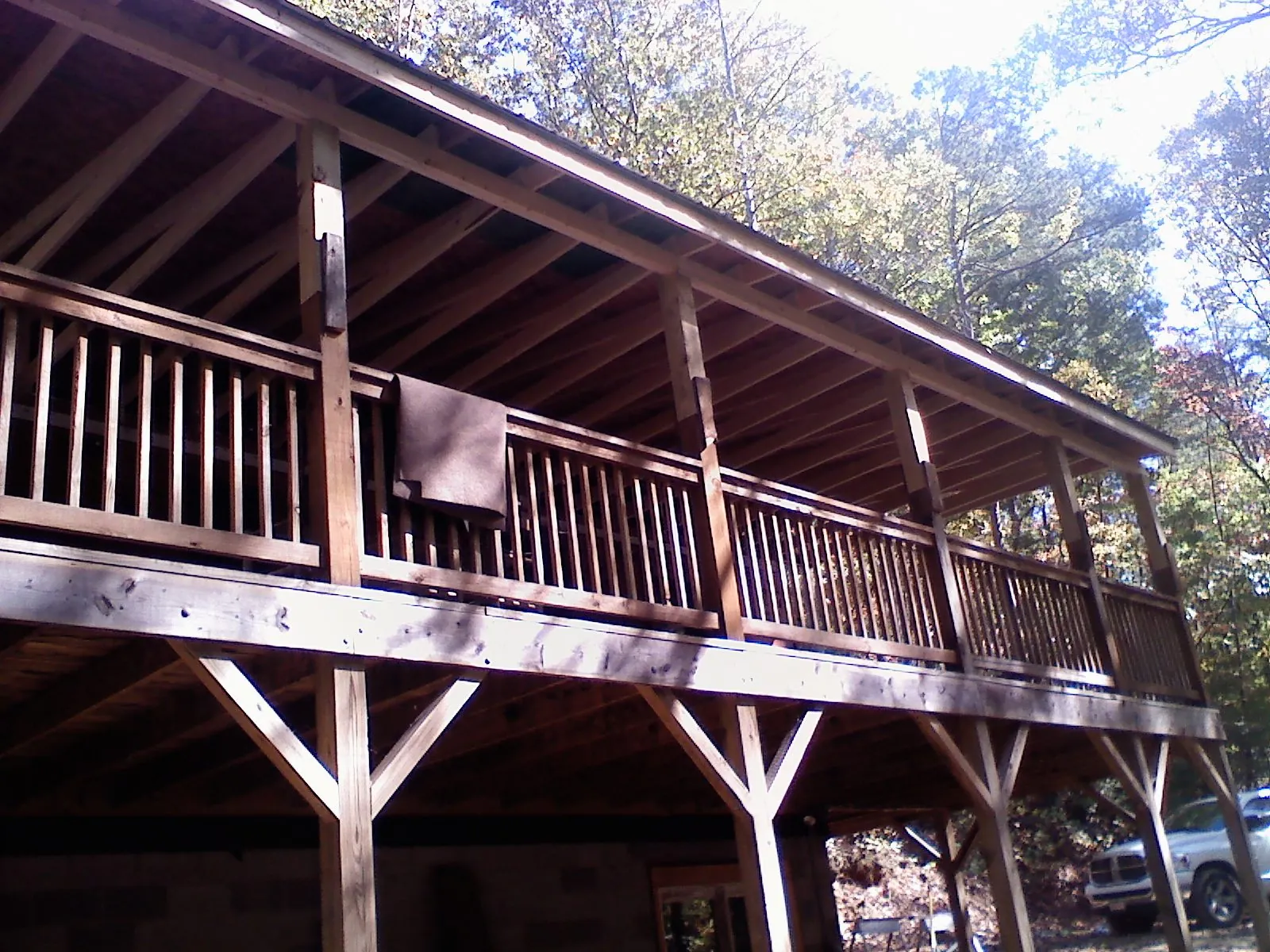 Timber framing under a new elevated porch and deck — Roof Leak Repair in Manistee by Roofing Brothers